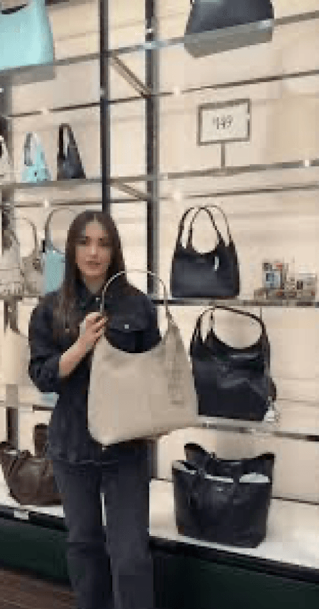 Woman wearing shoulder bag in store